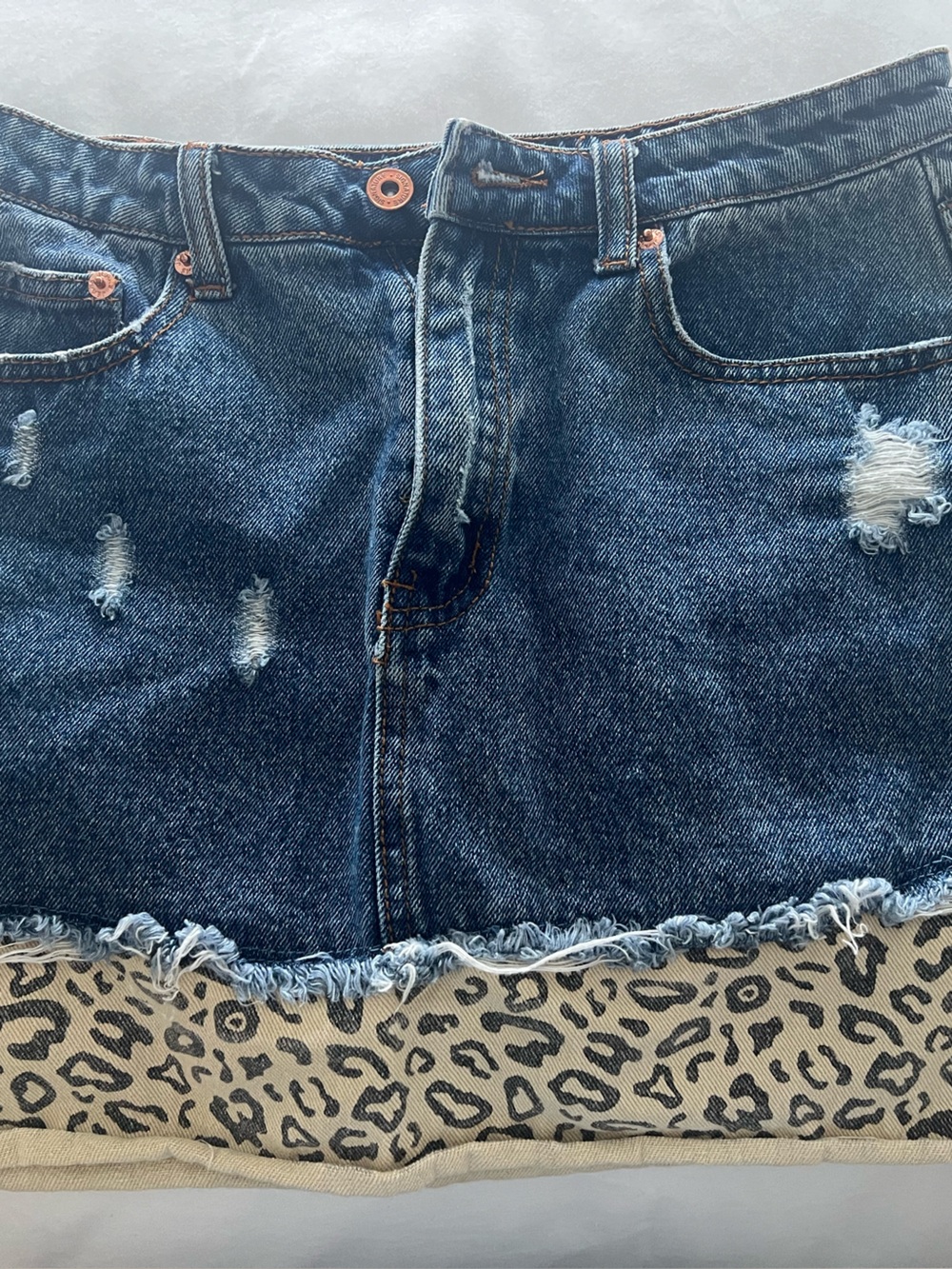 Signature Distressed Blue Denim Mini Skirt